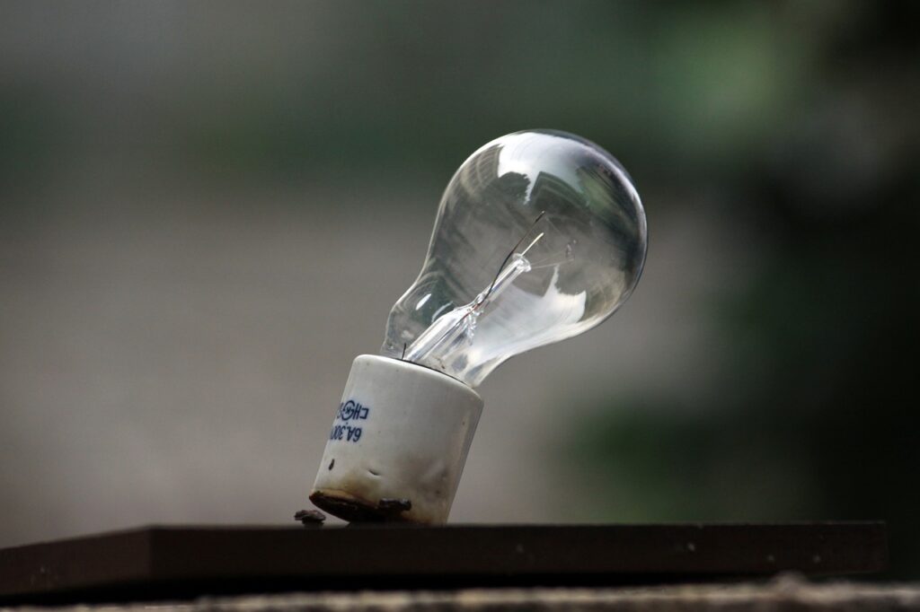 Broken light bulb expressing disadvantage
